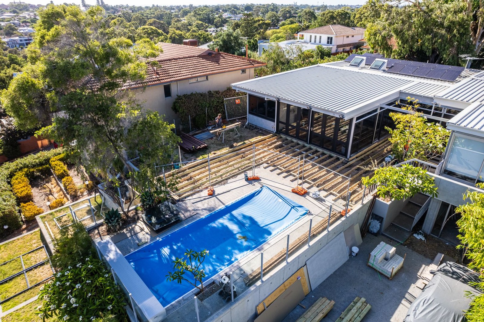 Aerial view of completed residence with pool